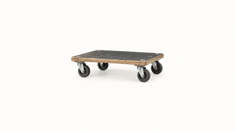 Isolated a heavy-duty dolly with four rubber castors centred on a seamless pale off-white studio background, generous empty margin on every side for overlaid branding