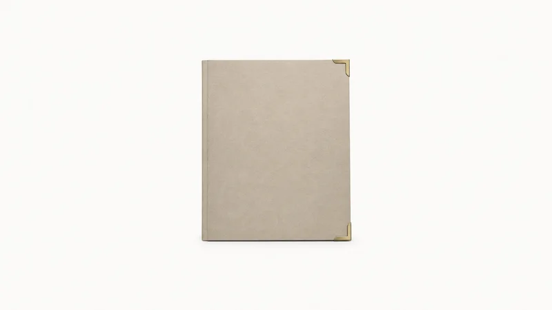 Isolated a blank deed folder with a brass corner clasp centred on a seamless pale off-white studio background, generous empty margin on every side for overlaid branding