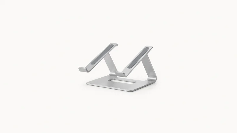 Isolated a laptop stand of folded bent aluminium centred on a seamless pale off-white studio background, generous empty margin on every side for overlaid branding