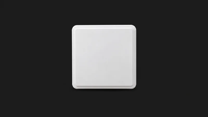 Isolated a compact rfid reader antenna panel in a flat white housing centred on a seamless deep charcoal near-black studio background, generous empty margin on every side for overlaid branding
