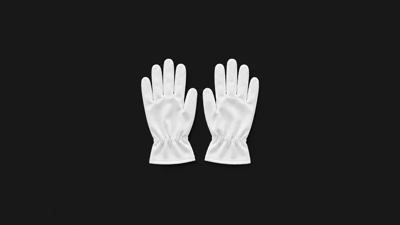 Isolated a pair of white cleanroom gloves laid flat centred on a seamless deep charcoal near-black studio background, generous empty margin on every side for overlaid branding