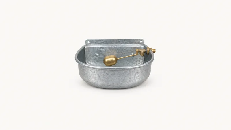 Isolated a galvanised cattle drinking trough bowl with a brass float valve centred on a seamless pale off-white studio background, generous empty margin on every side for overlaid branding