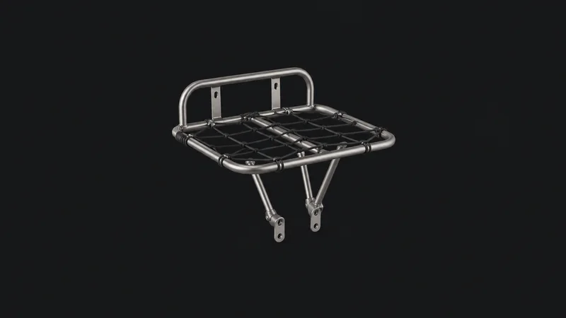 Isolated a stainless-steel cargo-bike front carrier rack with a bungee net centred on a seamless deep charcoal near-black studio background, generous empty margin on every side for overlaid branding
