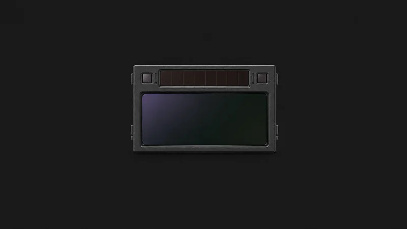 Isolated an auto-darkening welding helmet lens centred on a seamless deep charcoal near-black studio background, generous empty margin on every side for overlaid branding