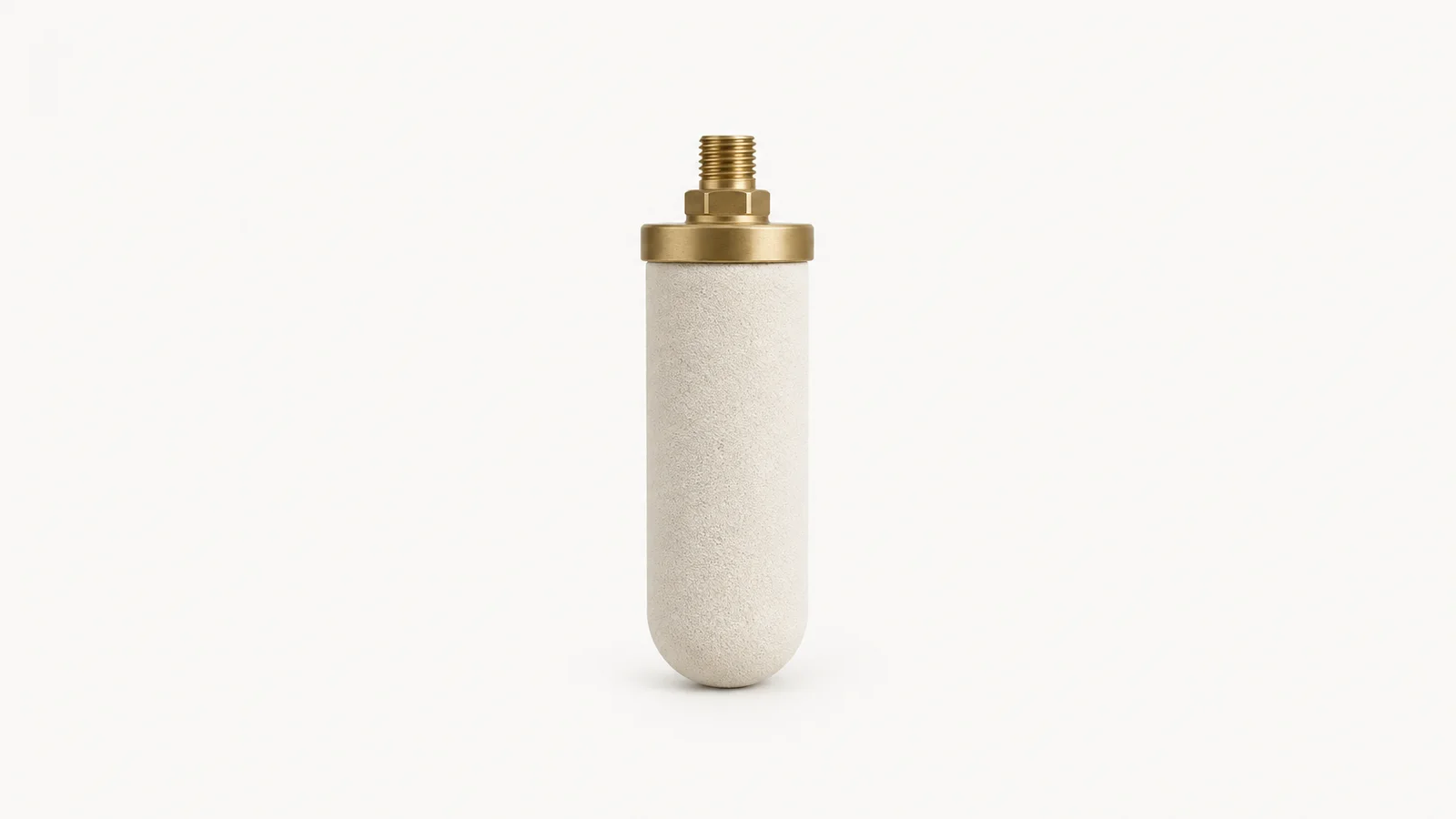 Isolated a ceramic filter candle with a brass fitting centred on a seamless pale off-white studio background, generous empty margin on every side for overlaid branding