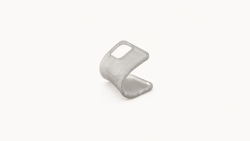 Isolated a flexible printed tpu phone-case blank folded back on itself centred on a seamless pale off-white studio background, generous empty margin on every side for overlaid branding