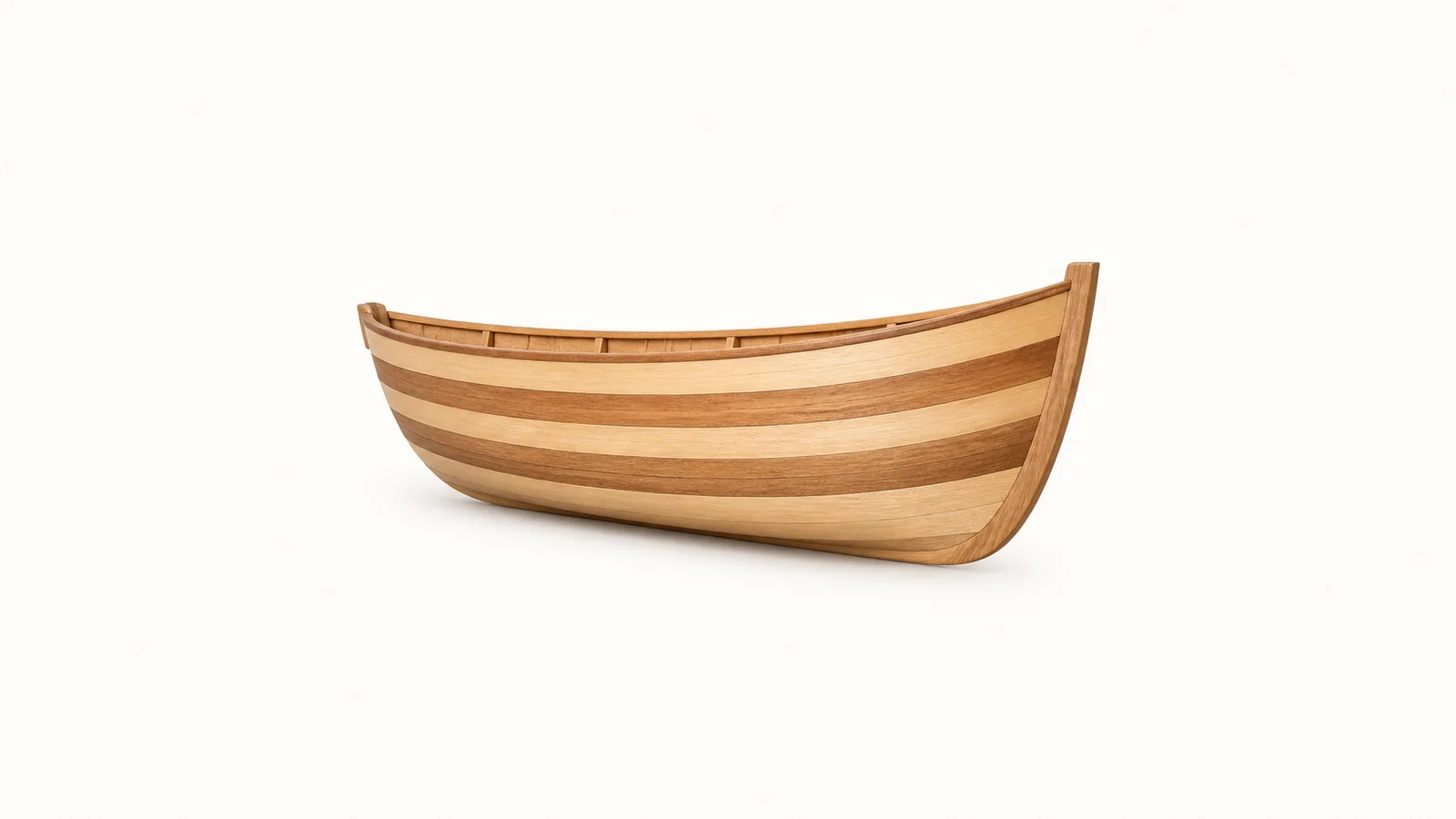 Isolated a half-model boat hull carved in lifts of alternating timber centred on a seamless pale off-white studio background, generous empty margin on every side for overlaid branding