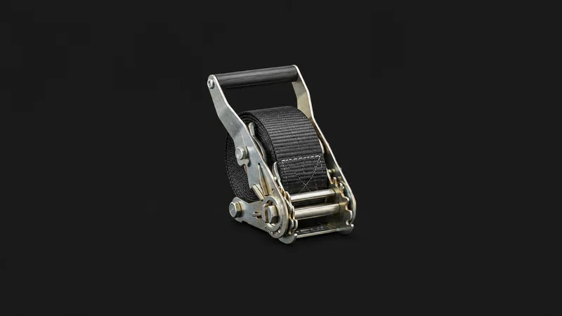 Isolated a nylon cargo-lashing strap wound on a ratchet tensioner centred on a seamless deep charcoal near-black studio background, generous empty margin on every side for overlaid branding