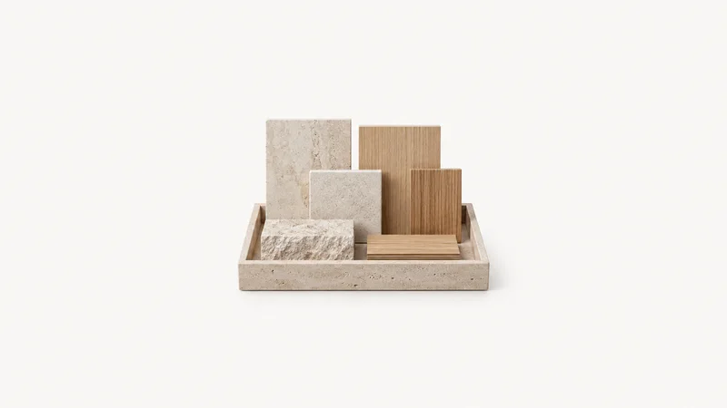 Isolated a stone and timber material sample set in a tray centred on a seamless pale off-white studio background, generous empty margin on every side for overlaid branding