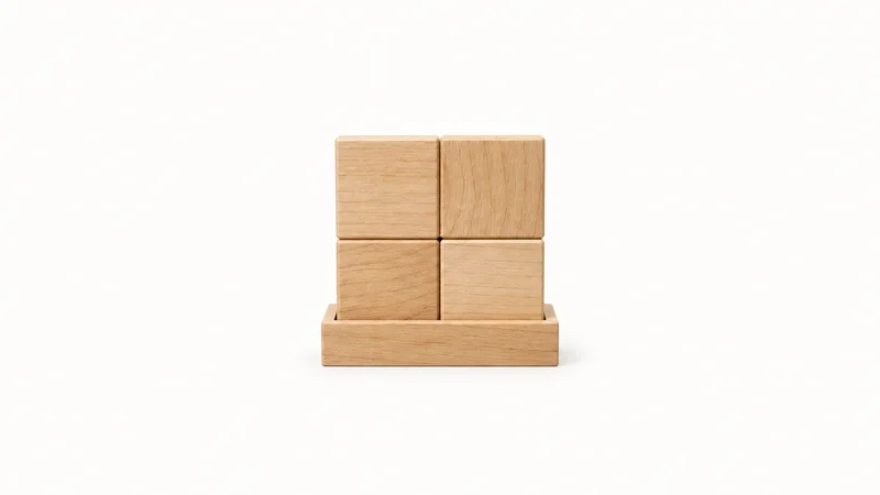 Isolated a wooden two-by-two matrix block on a base centred on a seamless pale off-white studio background, generous empty margin on every side for overlaid branding