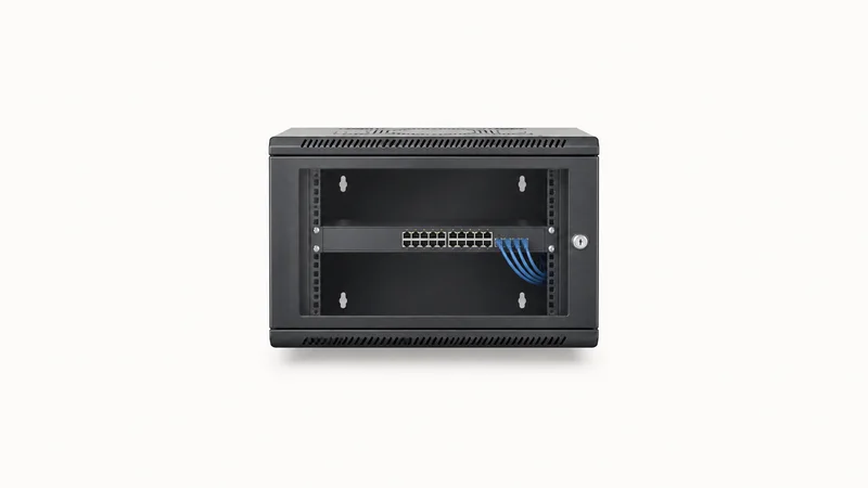 Isolated a wall-mount cabinet holding a single network switch centred on a seamless pale off-white studio background, generous empty margin on every side for overlaid branding