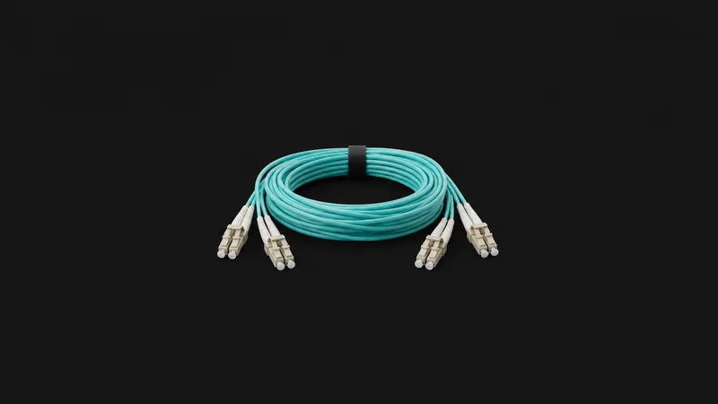 Isolated a bundle of aqua duplex fibre cables with LC connectors centred on a seamless deep charcoal near-black studio background, generous empty margin on every side for overlaid branding