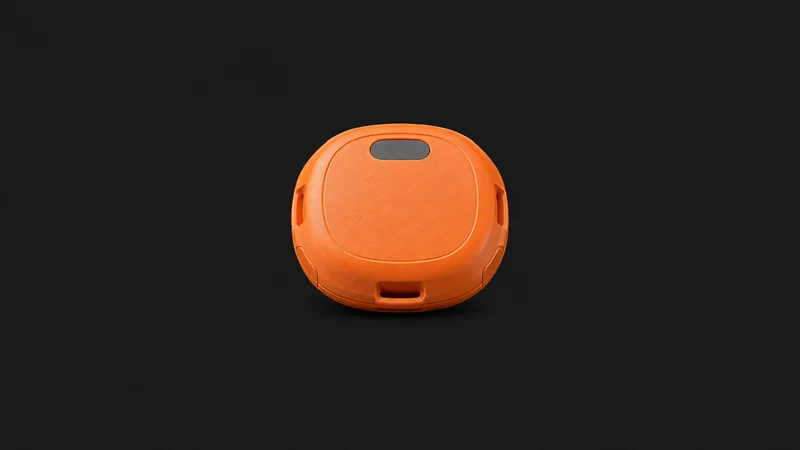 Isolated an asset-tracking beacon in a small rounded orange shell centred on a seamless deep charcoal near-black studio background, generous empty margin on every side for overlaid branding