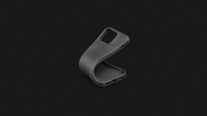 Isolated a flexible printed tpu phone-case blank folded back on itself centred on a seamless deep charcoal near-black studio background, generous empty margin on every side for overlaid branding