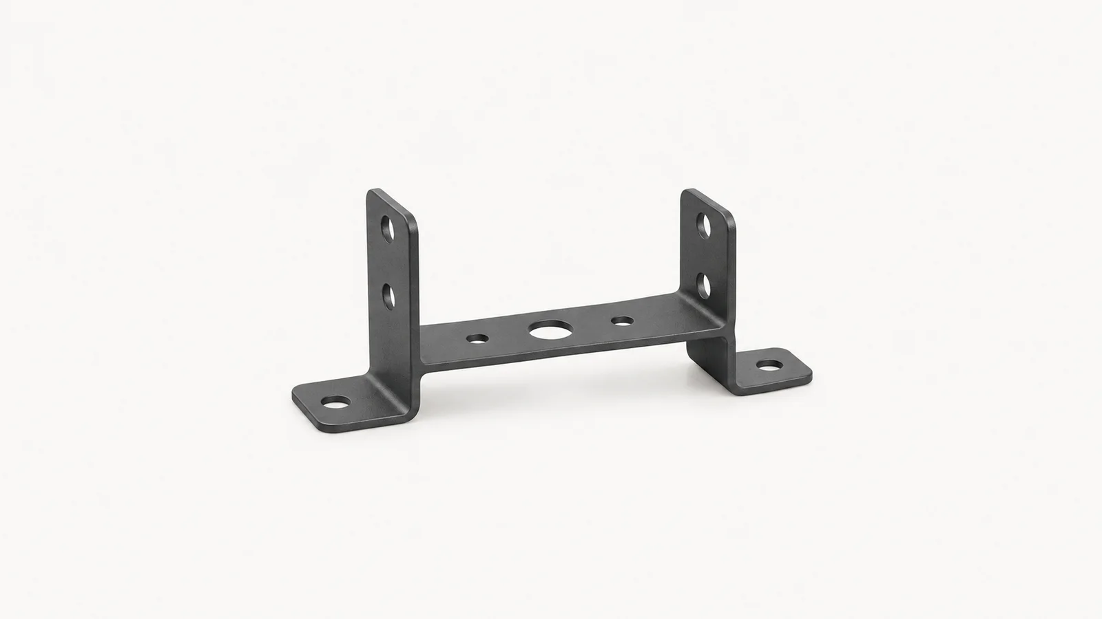 Isolated a stamped sheet-metal bracket with a powder-coated finish centred on a seamless pale off-white studio background, generous empty margin on every side for overlaid branding