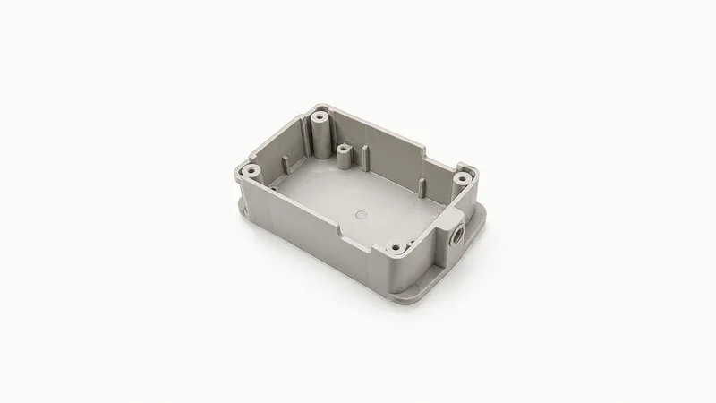 Isolated a moulded plastic housing with ejector-pin marks visible centred on a seamless pale off-white studio background, generous empty margin on every side for overlaid branding