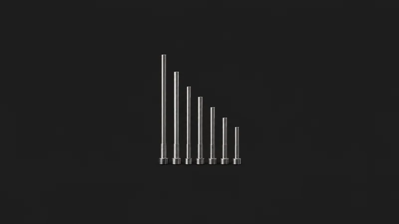 Isolated a set of ejector pins in graduated lengths centred on a seamless deep charcoal near-black studio background, generous empty margin on every side for overlaid branding