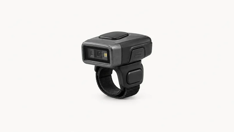 Isolated a wireless barcode ring scanner centred on a seamless pale off-white studio background, generous empty margin on every side for overlaid branding
