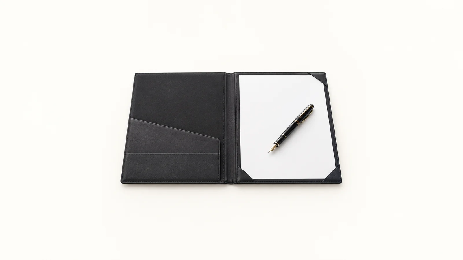 Isolated a fountain pen resting on a blank sheet inside a signing folder centred on a seamless pale off-white studio background, generous empty margin on every side for overlaid branding