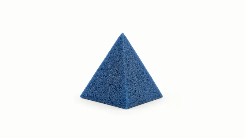 Isolated a blue radar-absorbing foam pyramid centred on a seamless pale off-white studio background, generous empty margin on every side for overlaid branding