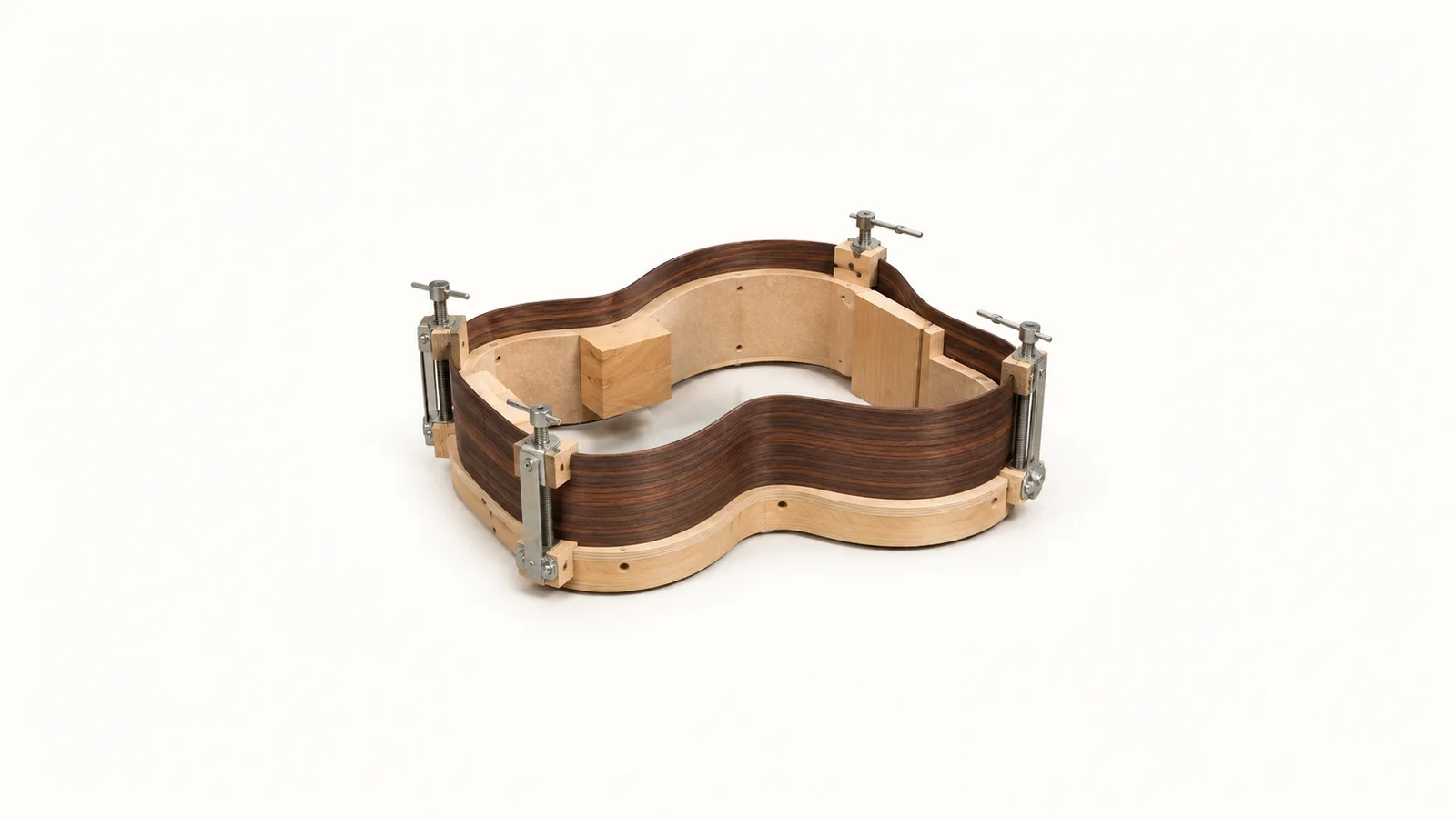 Isolated a bent guitar side of rosewood clamped on a bending form centred on a seamless pale off-white studio background, generous empty margin on every side for overlaid branding