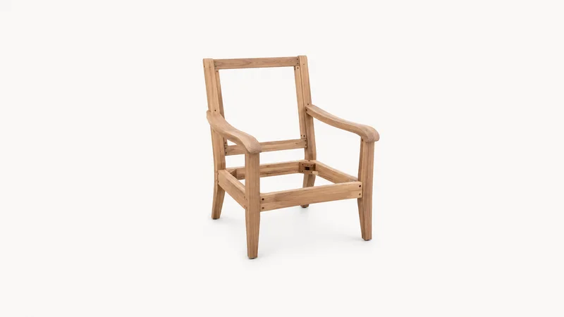Isolated a stripped hardwood armchair frame centred on a seamless pale off-white studio background, generous empty margin on every side for overlaid branding