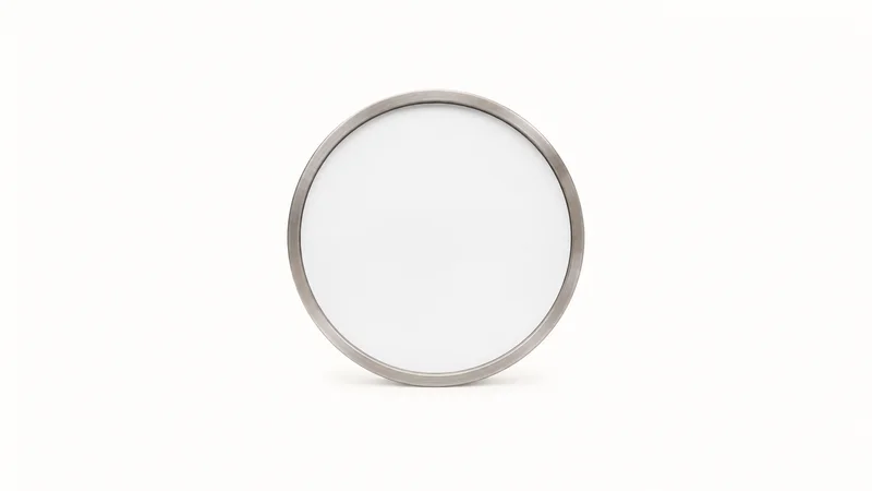 Isolated a wall clock with a blank face and a timekeeping bezel centred on a seamless pale off-white studio background, generous empty margin on every side for overlaid branding