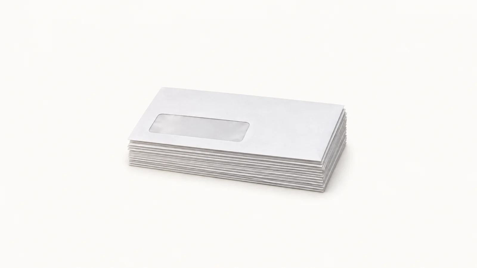 Isolated a stack of blank claim envelopes with window panels centred on a seamless pale off-white studio background, generous empty margin on every side for overlaid branding