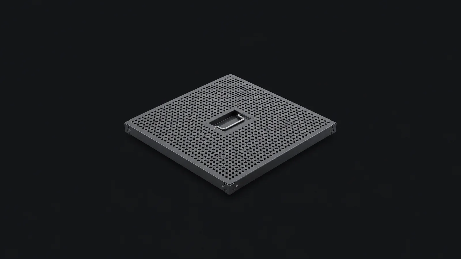 Isolated a perforated raised-floor tile with a lifting handle centred on a seamless deep charcoal near-black studio background, generous empty margin on every side for overlaid branding