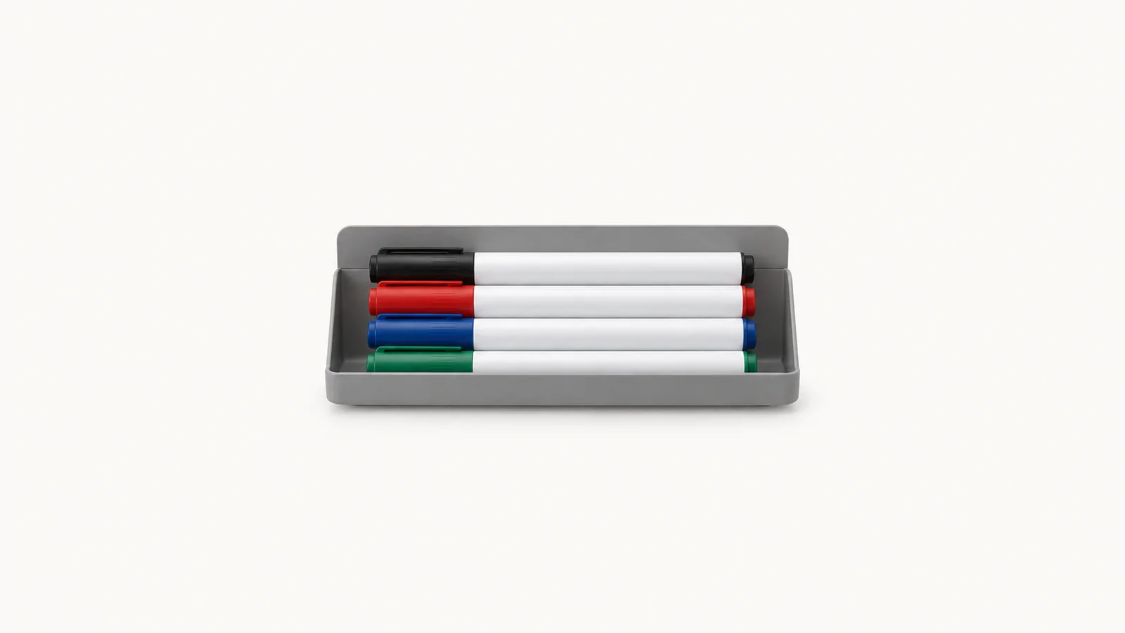 Isolated a whiteboard marker set in a magnetic tray centred on a seamless pale off-white studio background, generous empty margin on every side for overlaid branding