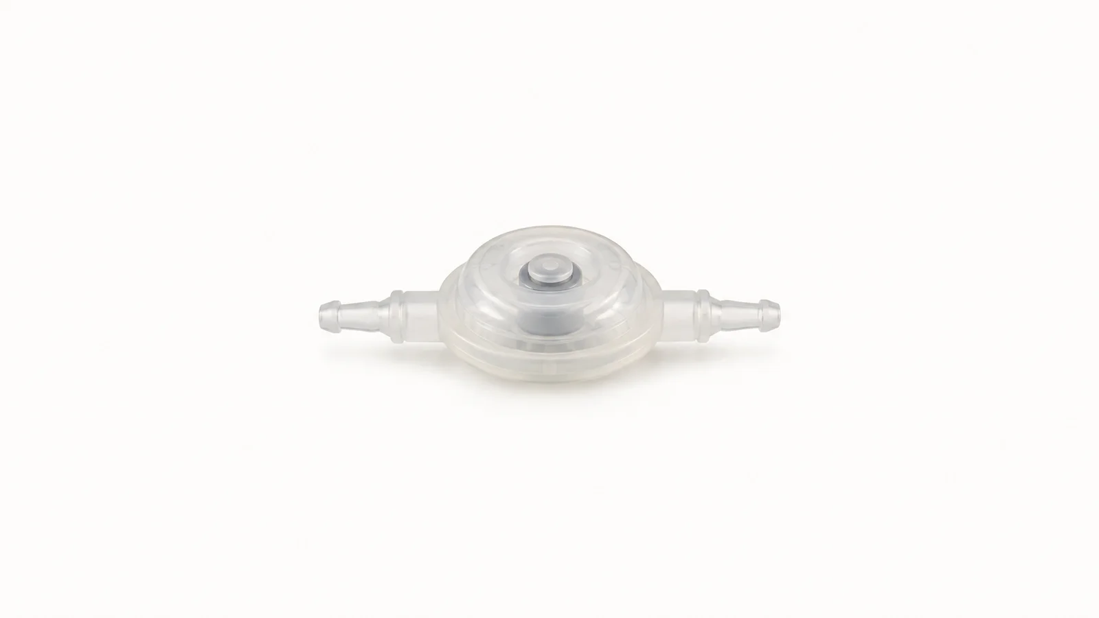 Isolated a silicone hydrocephalus shunt valve centred on a seamless pale off-white studio background, generous empty margin on every side for overlaid branding