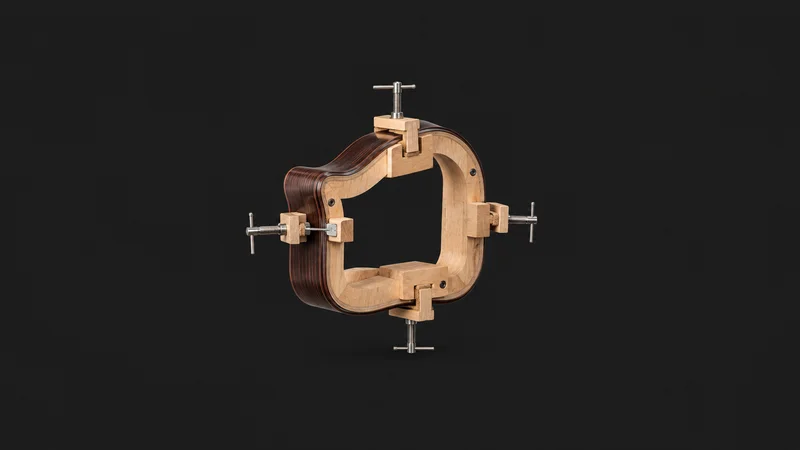 Isolated a bent guitar side of rosewood clamped on a bending form centred on a seamless deep charcoal near-black studio background, generous empty margin on every side for overlaid branding