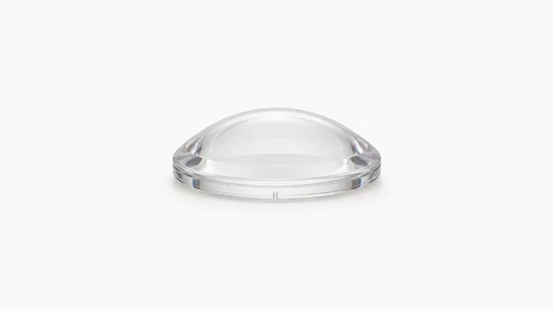 Isolated a clear polycarbonate moulded lens blank centred on a seamless pale off-white studio background, generous empty margin on every side for overlaid branding