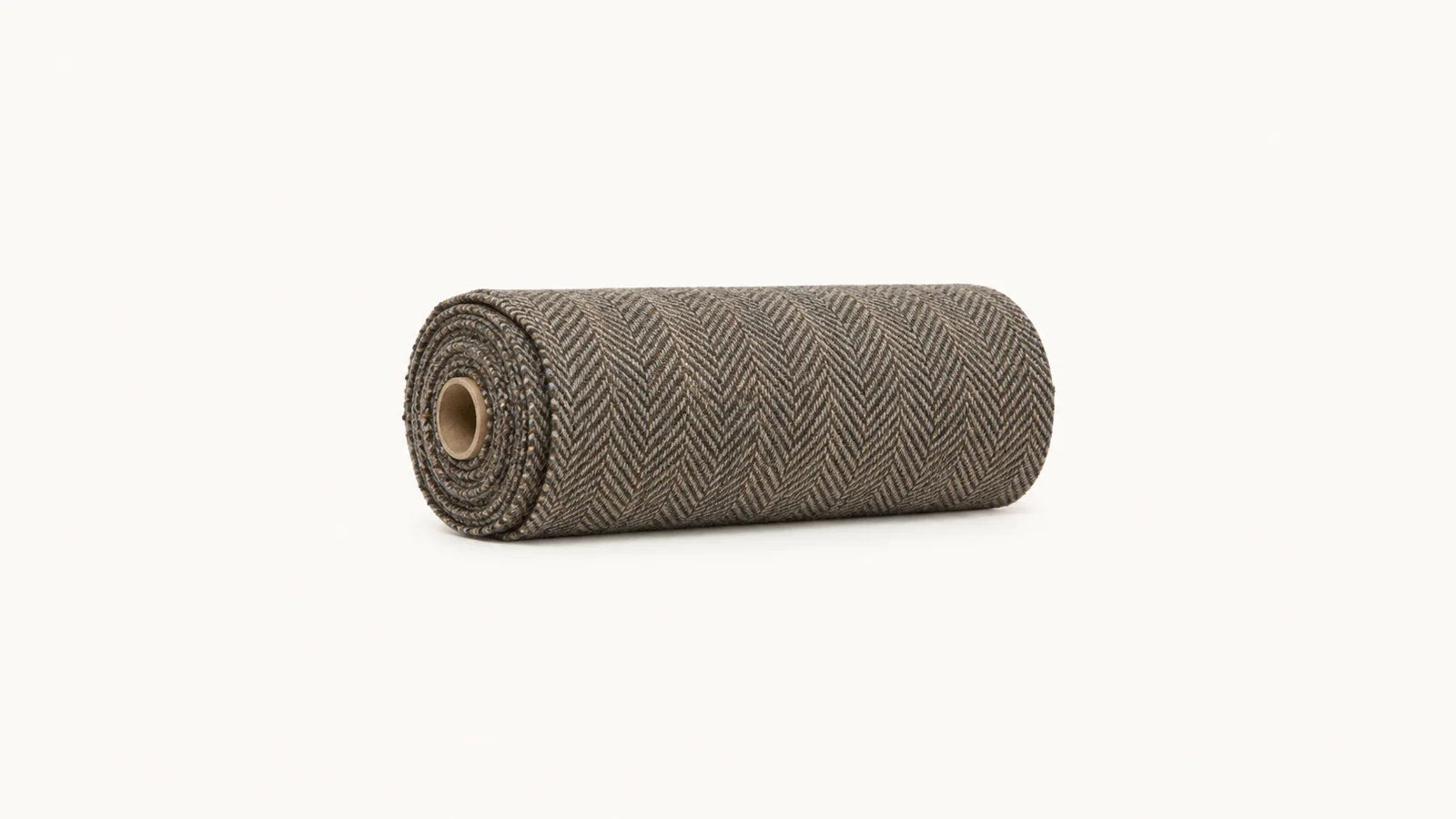 Isolated a rolled bolt of herringbone tweed centred on a seamless pale off-white studio background, generous empty margin on every side for overlaid branding