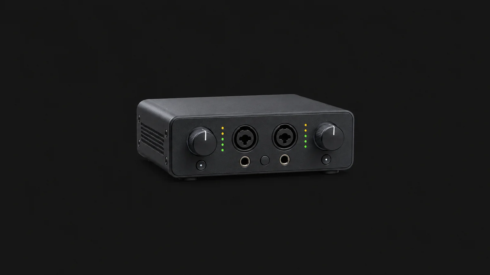 Isolated a compact audio interface with two gain knobs centred on a seamless deep charcoal near-black studio background, generous empty margin on every side for overlaid branding