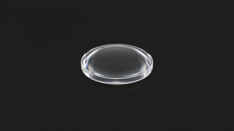 Isolated a clear polycarbonate moulded lens blank centred on a seamless deep charcoal near-black studio background, generous empty margin on every side for overlaid branding