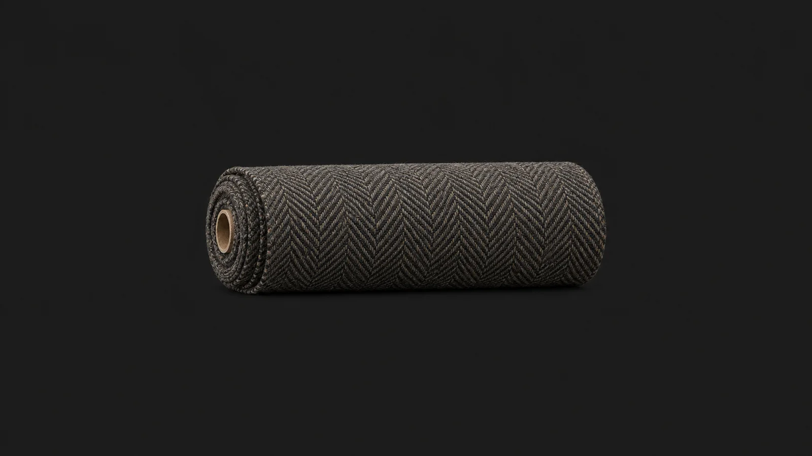 Isolated a rolled bolt of herringbone tweed centred on a seamless deep charcoal near-black studio background, generous empty margin on every side for overlaid branding