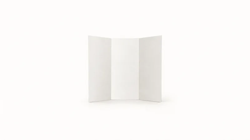 Isolated a blank folded tri-fold brochure standing on its edge centred on a seamless pale off-white studio background, generous empty margin on every side for overlaid branding
