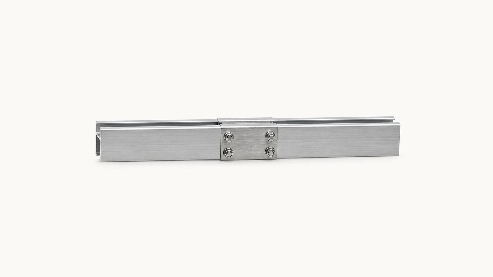 Isolated a section of anodised mounting rail with a splice centred on a seamless pale off-white studio background, generous empty margin on every side for overlaid branding