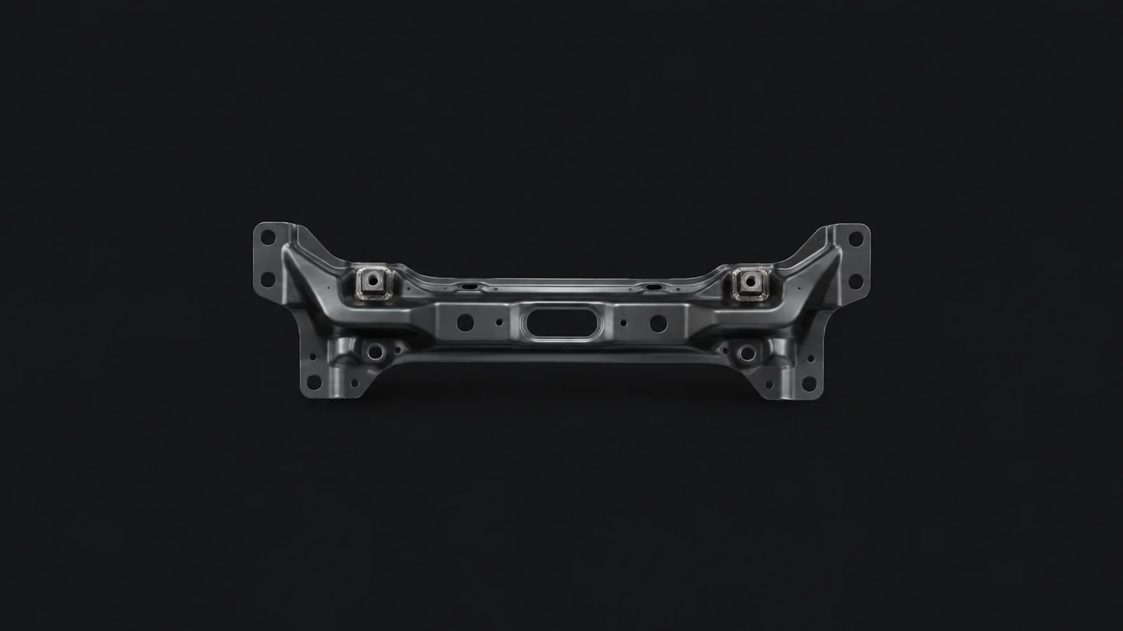 Isolated a stamped car chassis crossmember with weld nuts centred on a seamless deep charcoal near-black studio background, generous empty margin on every side for overlaid branding