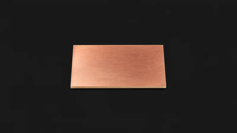Isolated a bare copper-clad laminate panel centred on a seamless deep charcoal near-black studio background, generous empty margin on every side for overlaid branding