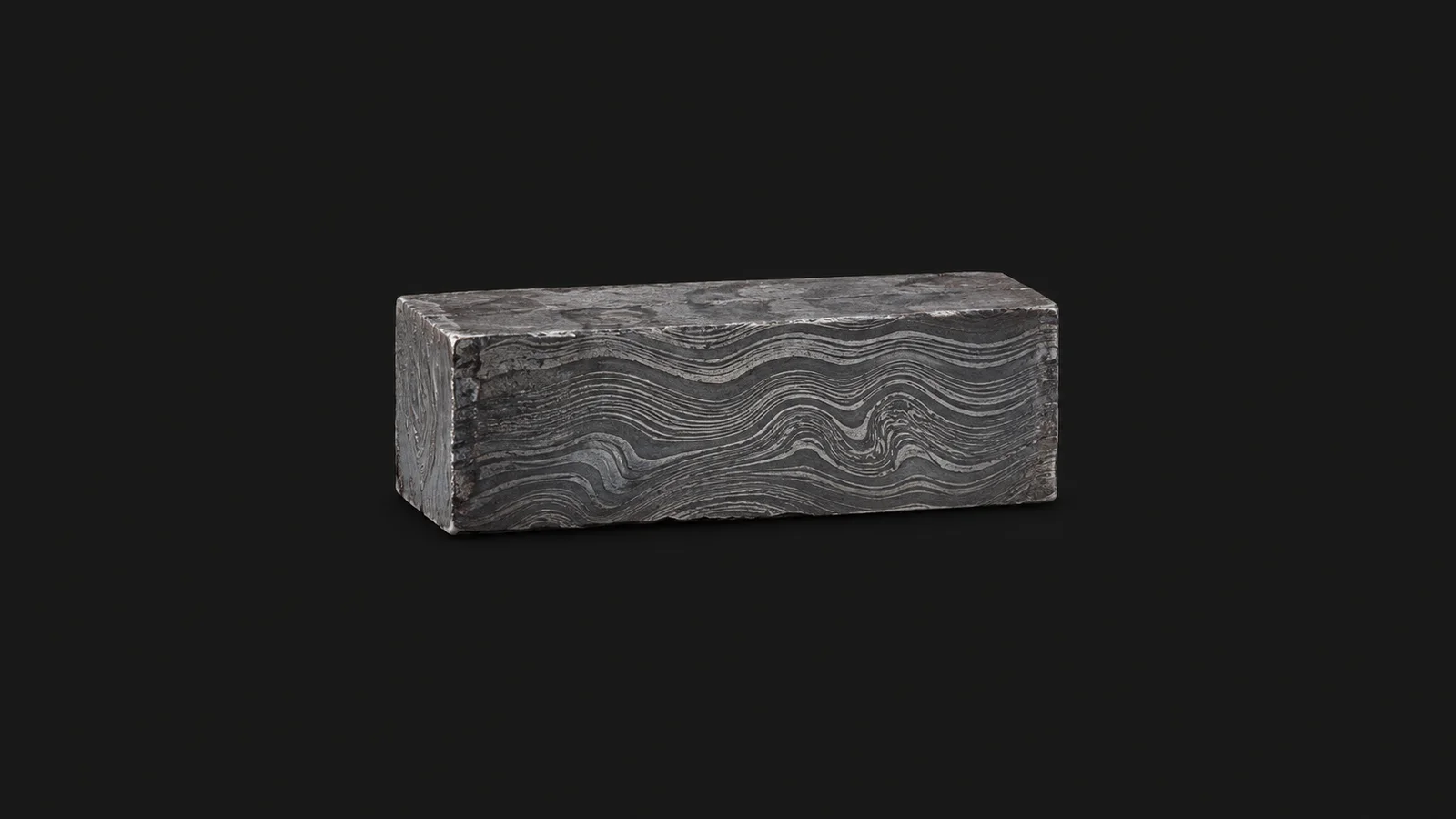 Isolated a forge-welded damascus billet with etched wavy layer pattern centred on a seamless deep charcoal near-black studio background, generous empty margin on every side for overlaid branding