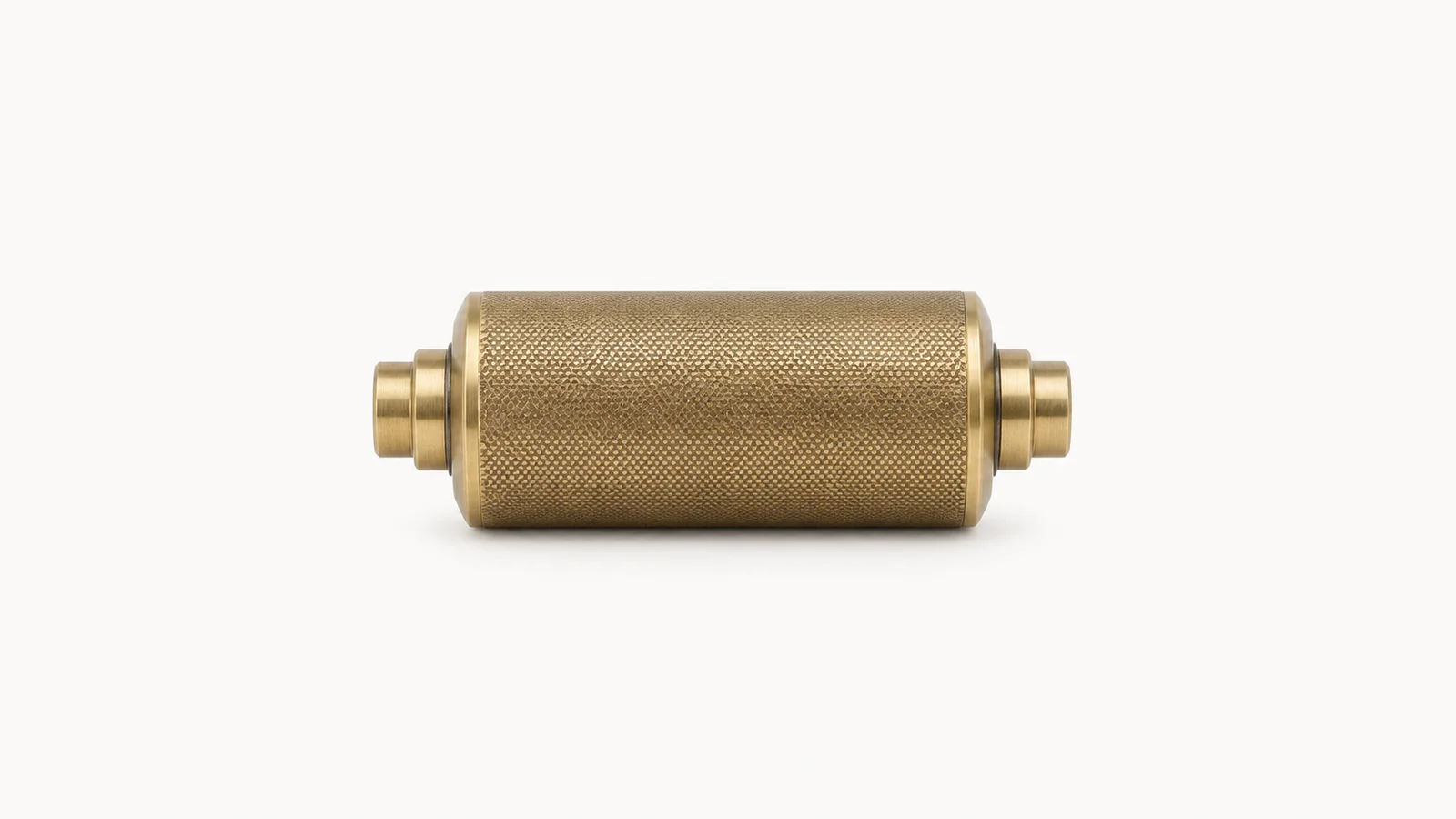 Isolated a brass anilox roller section with a fine cell-pattern surface centred on a seamless pale off-white studio background, generous empty margin on every side for overlaid branding