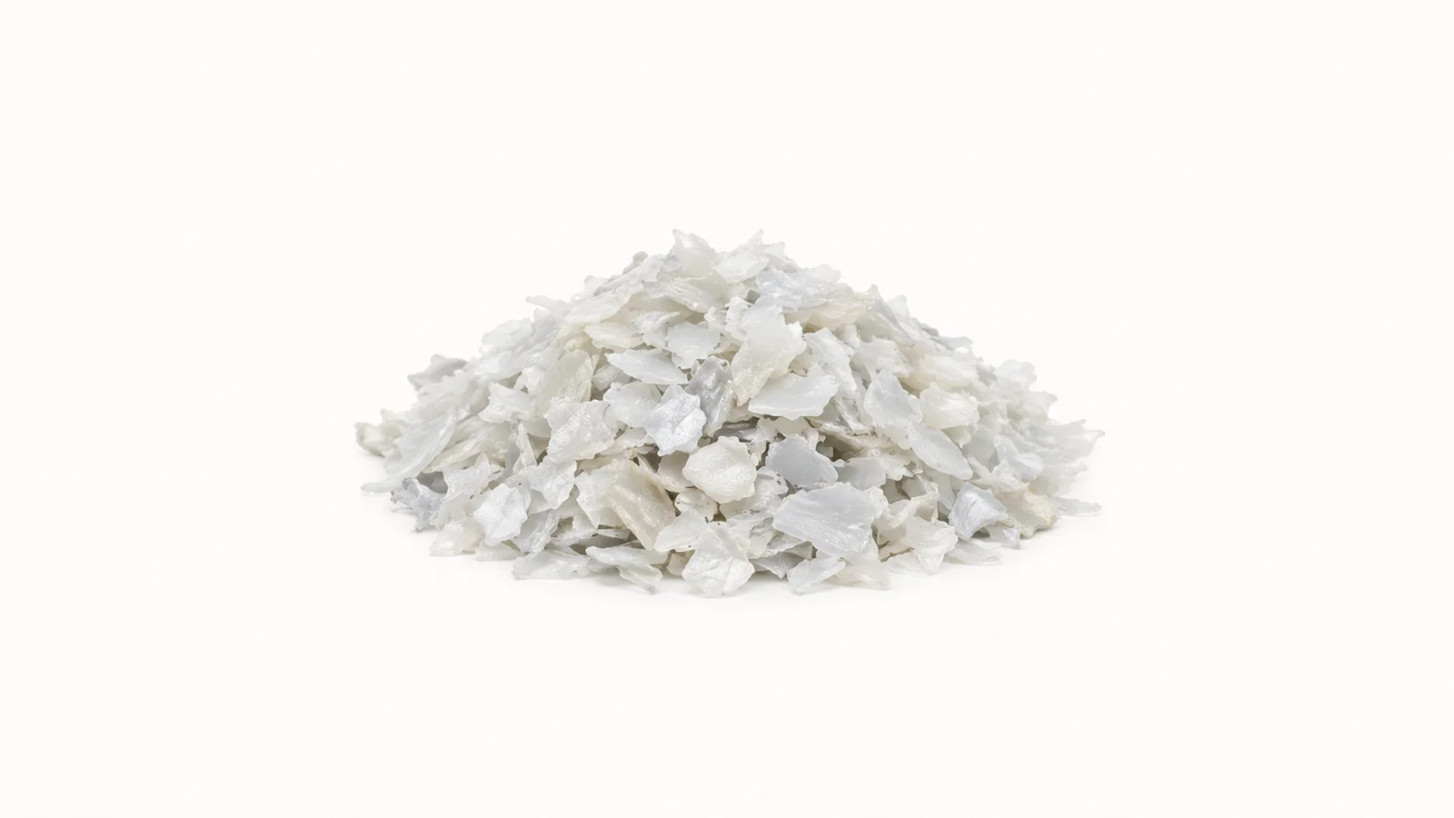 Isolated a handful of granulated HDPE regrind centred on a seamless pale off-white studio background, generous empty margin on every side for overlaid branding