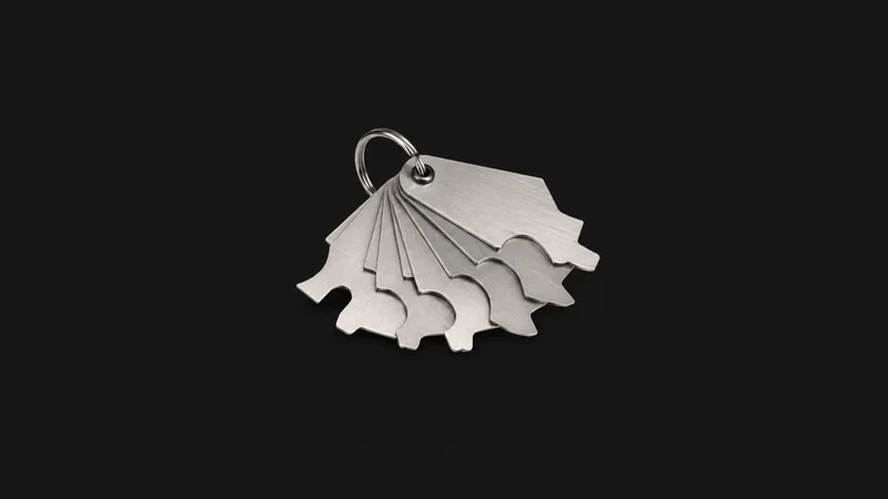 Isolated a fillet-weld gauge set centred on a seamless deep charcoal near-black studio background, generous empty margin on every side for overlaid branding