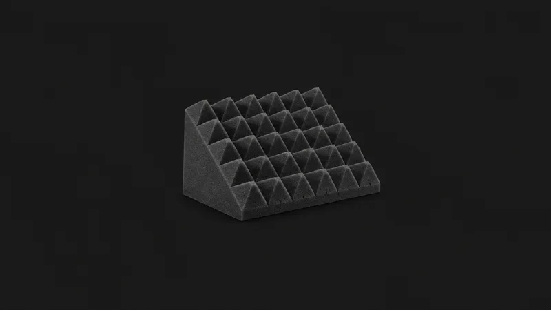 Isolated a wedge of acoustic foam with a pyramid surface centred on a seamless deep charcoal near-black studio background, generous empty margin on every side for overlaid branding