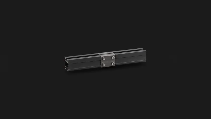 Isolated a section of anodised mounting rail with a splice centred on a seamless deep charcoal near-black studio background, generous empty margin on every side for overlaid branding