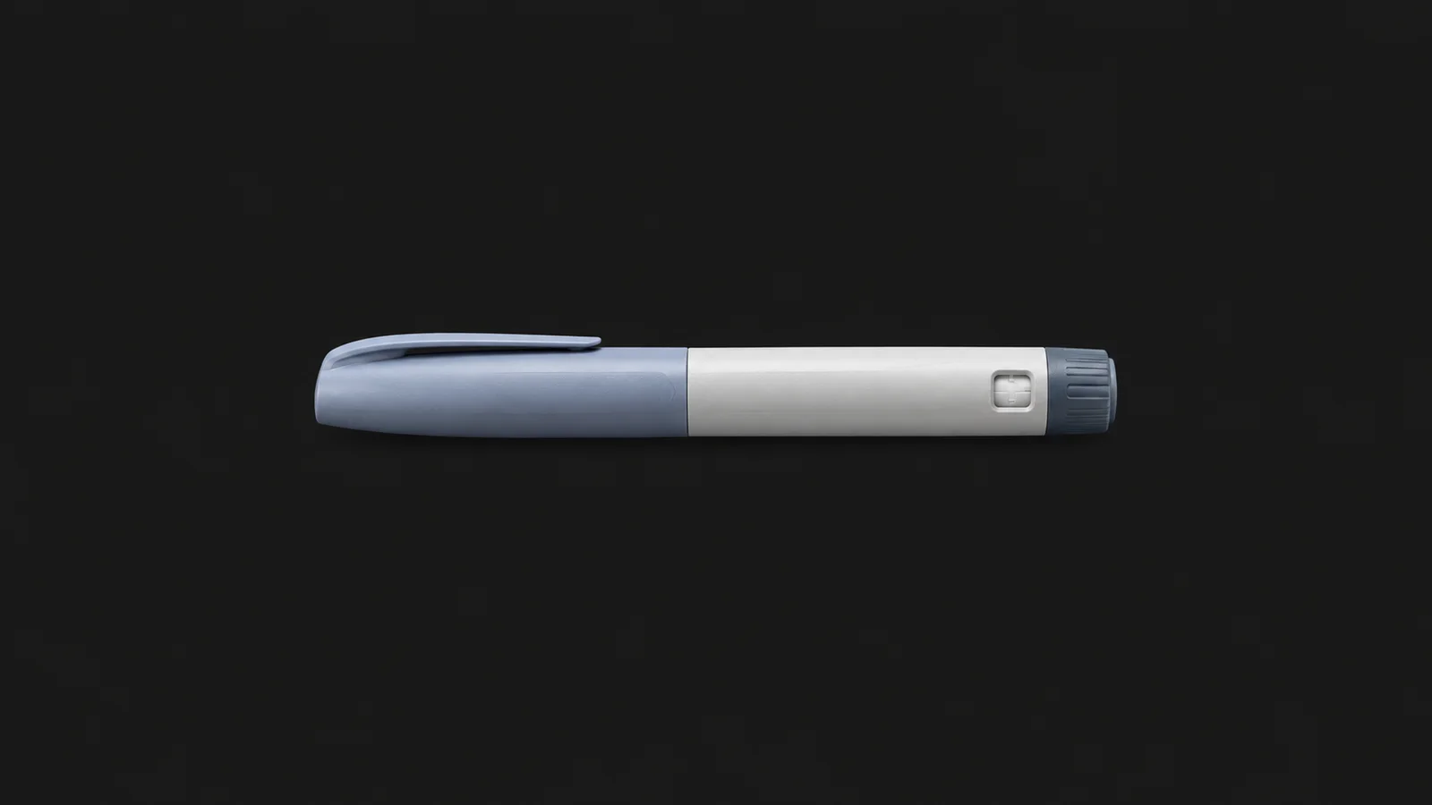 Isolated a disposable insulin pen injector body without markings centred on a seamless deep charcoal near-black studio background, generous empty margin on every side for overlaid branding
