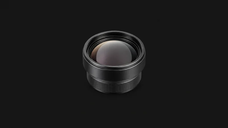 Isolated an infrared germanium lens with a dark metallic sheen centred on a seamless deep charcoal near-black studio background, generous empty margin on every side for overlaid branding