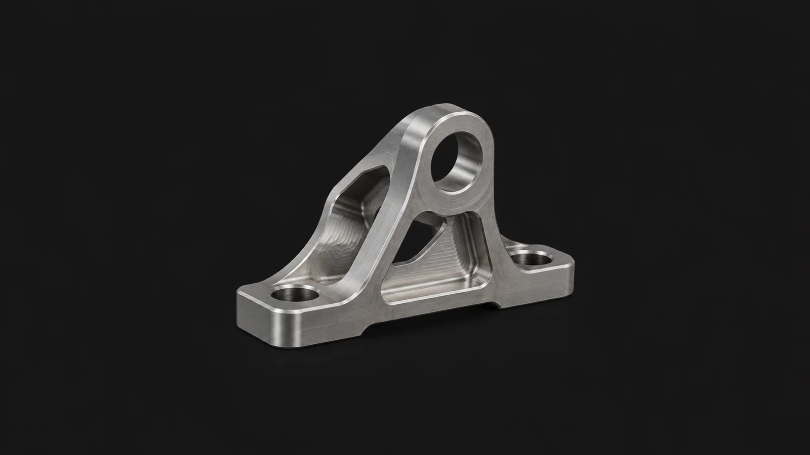 Isolated a titanium bracket with visible ball-mill scallop tool paths centred on a seamless deep charcoal near-black studio background, generous empty margin on every side for overlaid branding